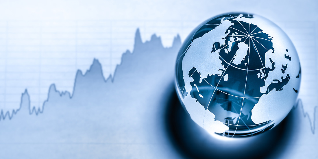 Globe of the Earth sitting on top of a linear graph