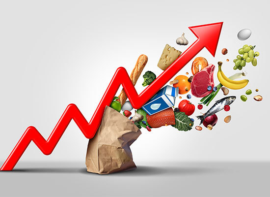 paper bag of groceries spilling along the red line of a chart going upwards, representing inflation