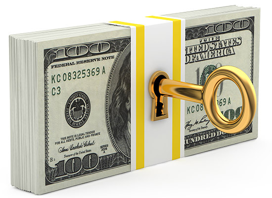 stack of money with a lock and key inside it