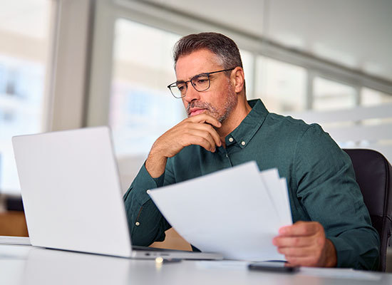 person looking at different types of ETF's on the web