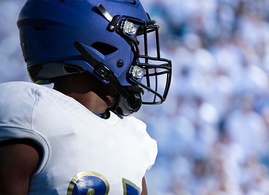 football player in helmet and shoulder pads