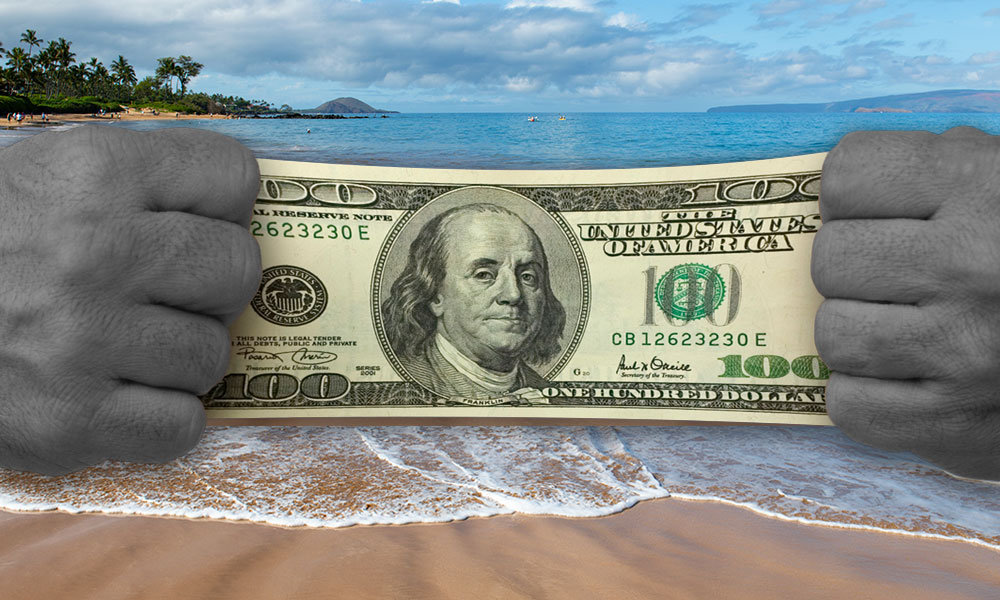 a one hundred dollar bill being stretched