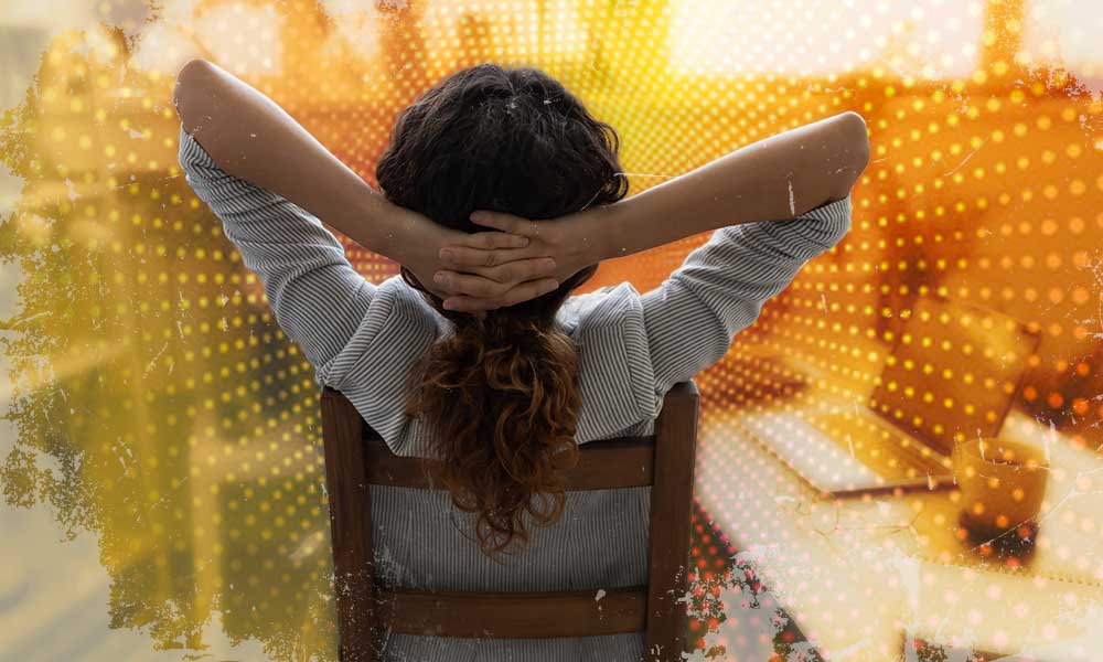 A person relaxing with hands behind their head, symbolizing the peace of mind that comes with effective retirement planning for self-employed individuals.