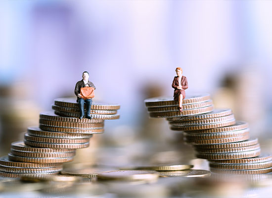 Stacks of coins with people sitting on them signifying their investments