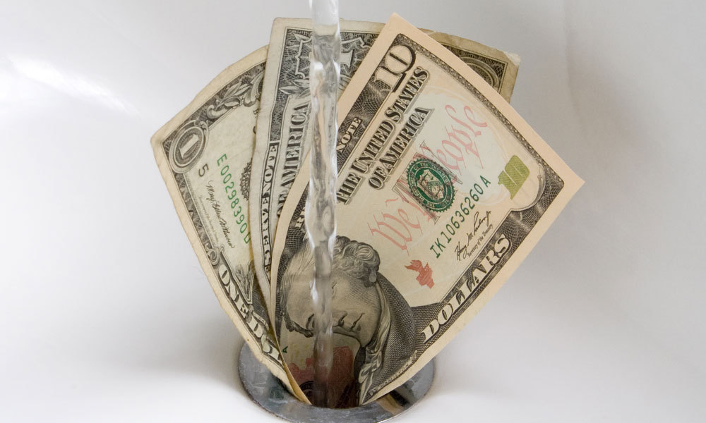 money stuffed down a drain