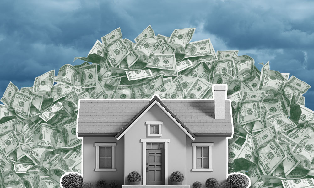 model home with a pile of mone behind it