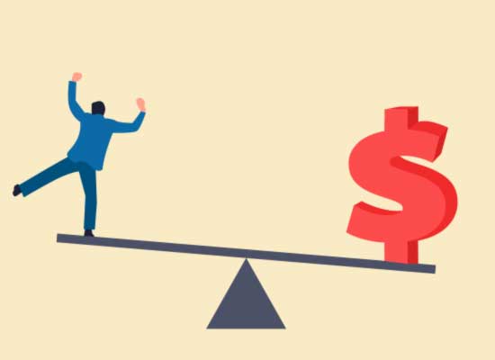 A man carefully balances on a seesaw against a dollar sign, illustrating the challenge of financial stability.