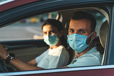 Masked couple taking a pandemic vacation
