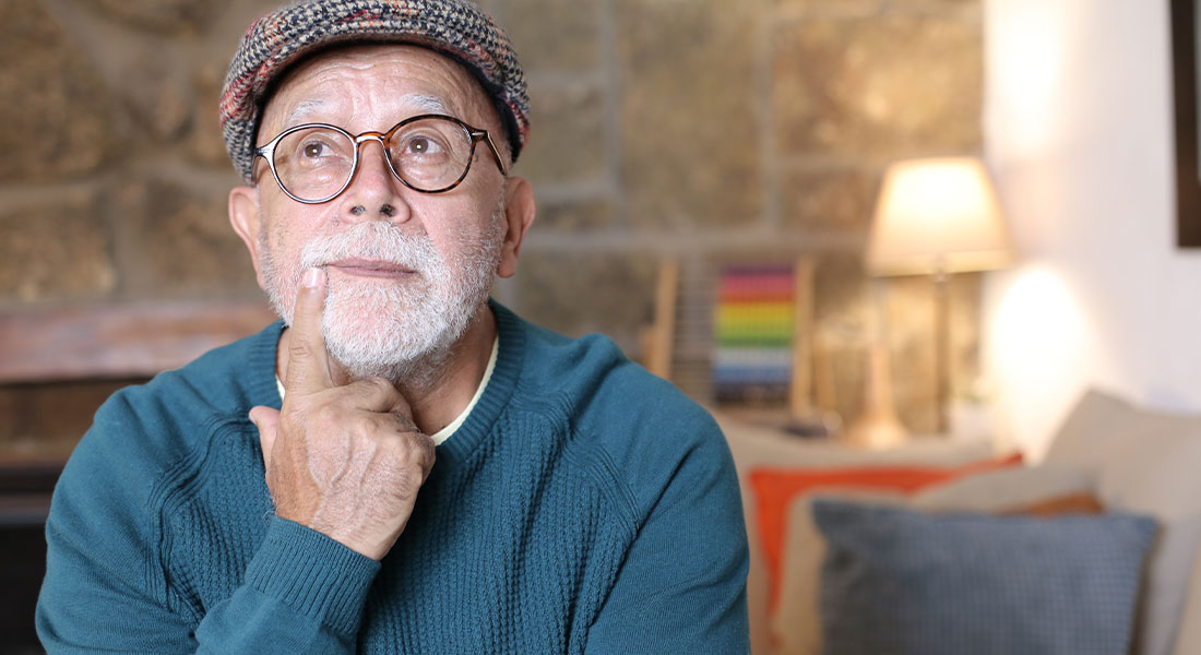 a retired man contemplating going back to work because of the rising inflation rates