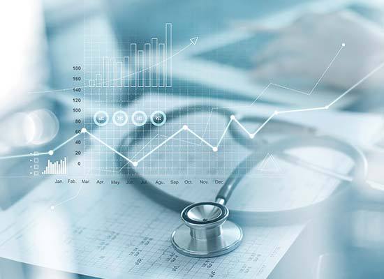 stethoscope on table with graph