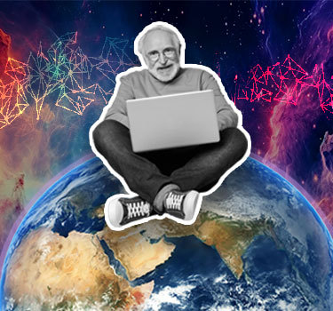 older man sitting on top of the world with a laptop