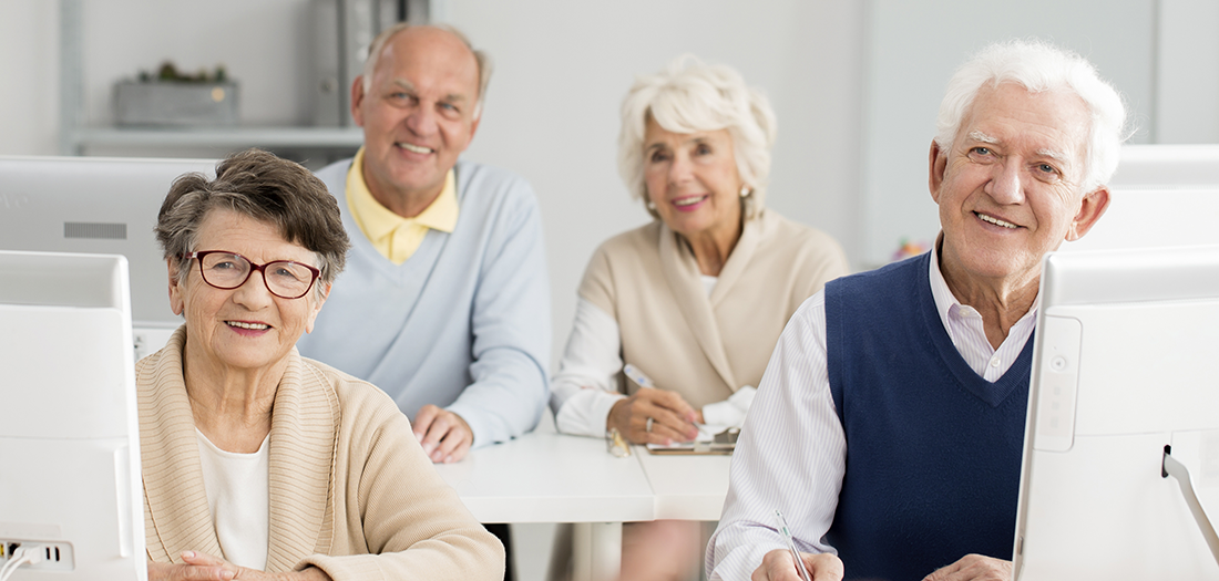 A group of seniors in a classroom learning