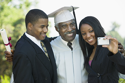 Family celebrating graduation of senior graduate