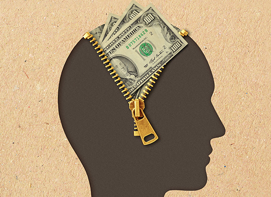 A silhouette of a human head unzipped to reveal cash inside