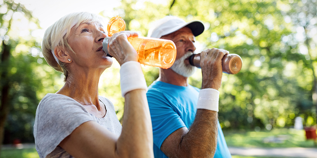 Active seniors working out and keeping hyrdrated