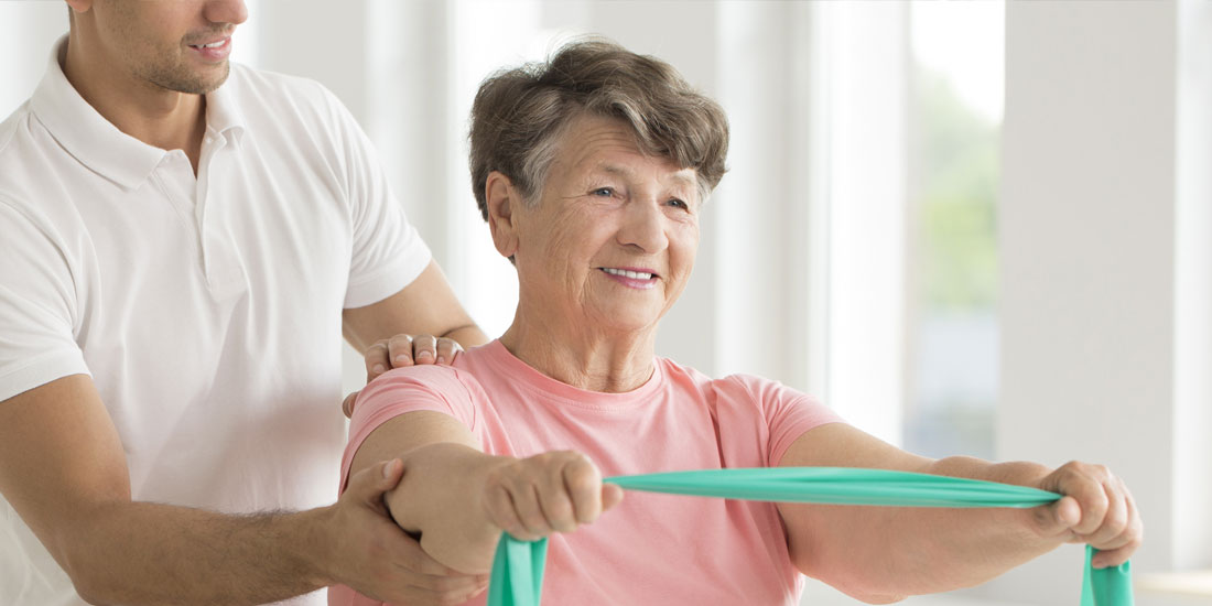 A senior woman at a physical therapy session