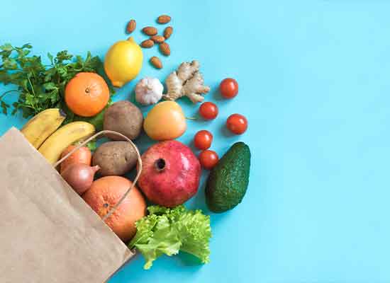 a grocery bag filled with nutritious foods for people over 50 years of age