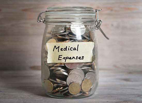 jar of money labeled medical expenses