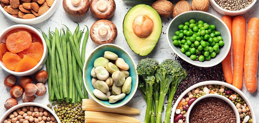 An assortment of healthy plant-based foods laid out on a table