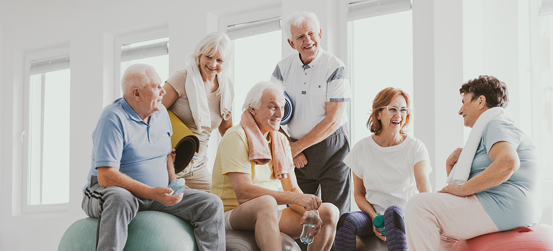 A group of seniors talking after an exercise class