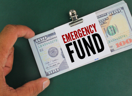 A bundle of cash labeled 'Emergency Fund' emphasizes the need for financial security and retirement savings.