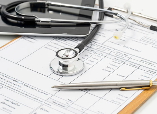 A stethoscope rests on a medical bill, illustrating the complexities of healthcare billing, CPT codes, medical procedure costs, physician reimbursement, and surgical billing codes.