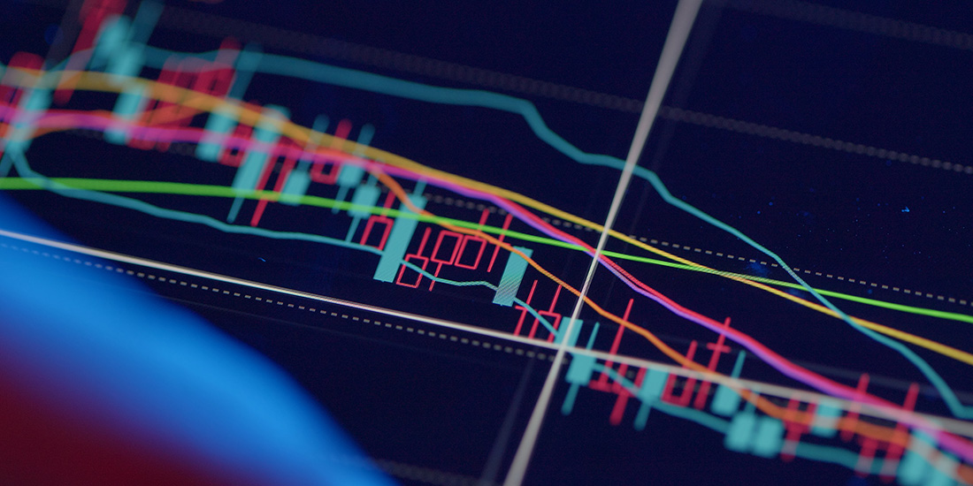 Economic statistics being tracked on a screen