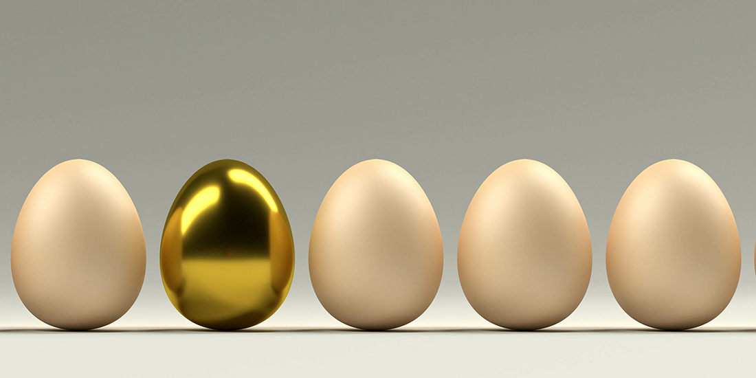 5 eggs with a golden one in the bunch.