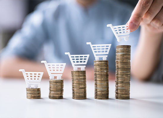 Someone stacking coins together to show an increase in cash flow from personal savings or investments