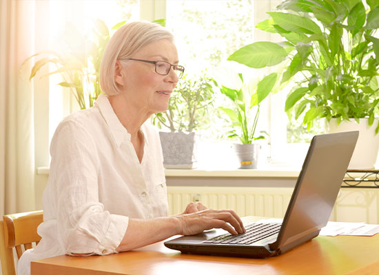 A woman working on her laptop.