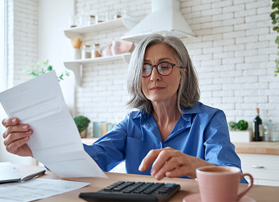 Woman calculating her living expenses