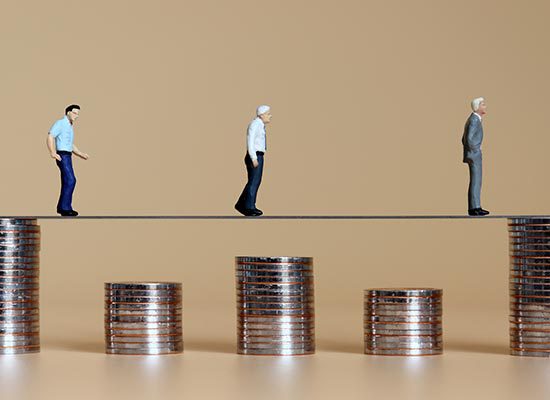 clay figures walking on stacks of coins