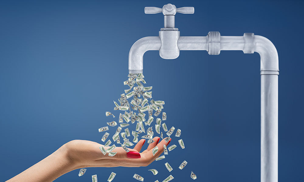 faucet with money falling out into someone's hand