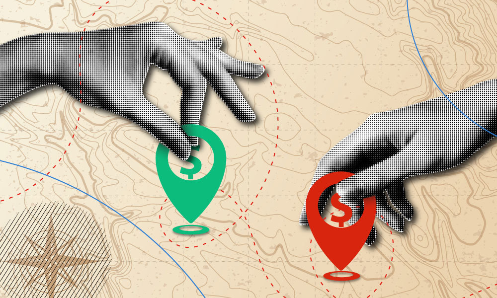 two hands placing gps markers on a map