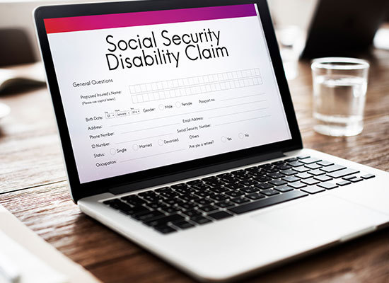 disability cliam form on laptop