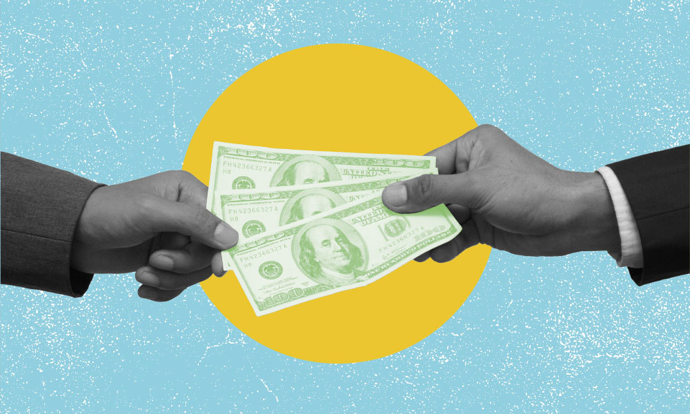 money being passed from one hand to another