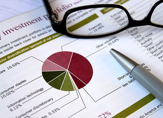eye glasses on top of investment portfoliio