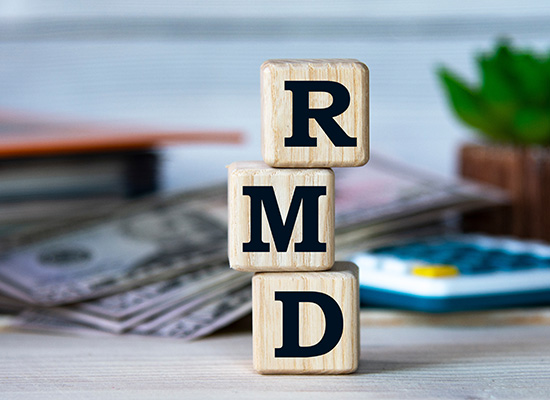 wooden blocks stacked on each other spelling out RMD