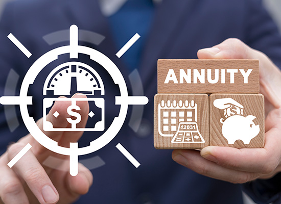 A person holding wooden blocks labeled 'Annuity' with financial icons, representing the concept of guaranteed income and annuities in retirement planning.