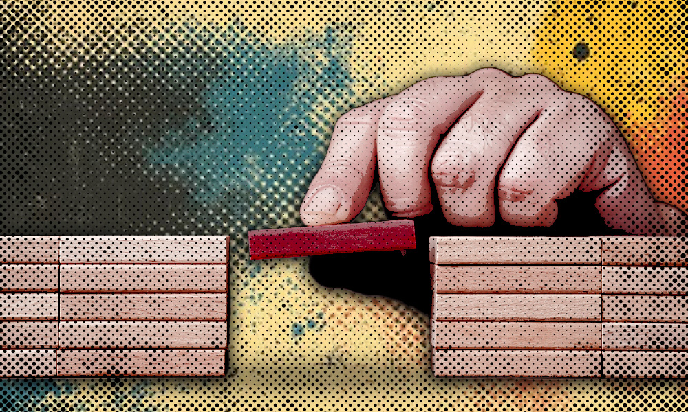 A hand places a small red block between two stacks of wooden blocks, symbolizing the gap between financial expectations and the realities faced by retirees.
