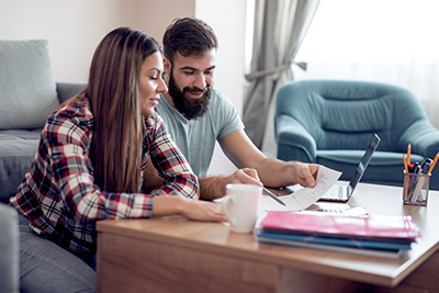 Young couple talking about family finances