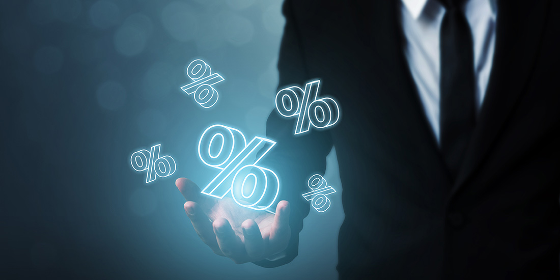 Man in a suit managing money and percentages