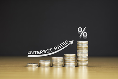 Interest rates going up illustrated by stacks of coins