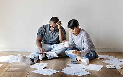 Young couple struggling with their budget and debt
