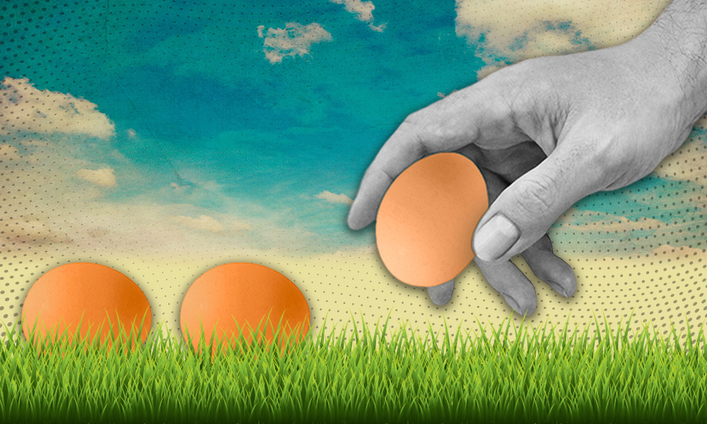 A surreal image depicting a giant grayscale human hand placing a brown egg on a vibrant, grassy field under a painted sky, with two similar eggs already on the ground.