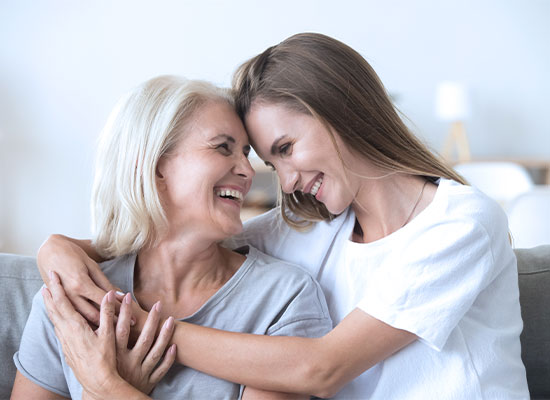 A daughter helping a mother with her assisted living transition