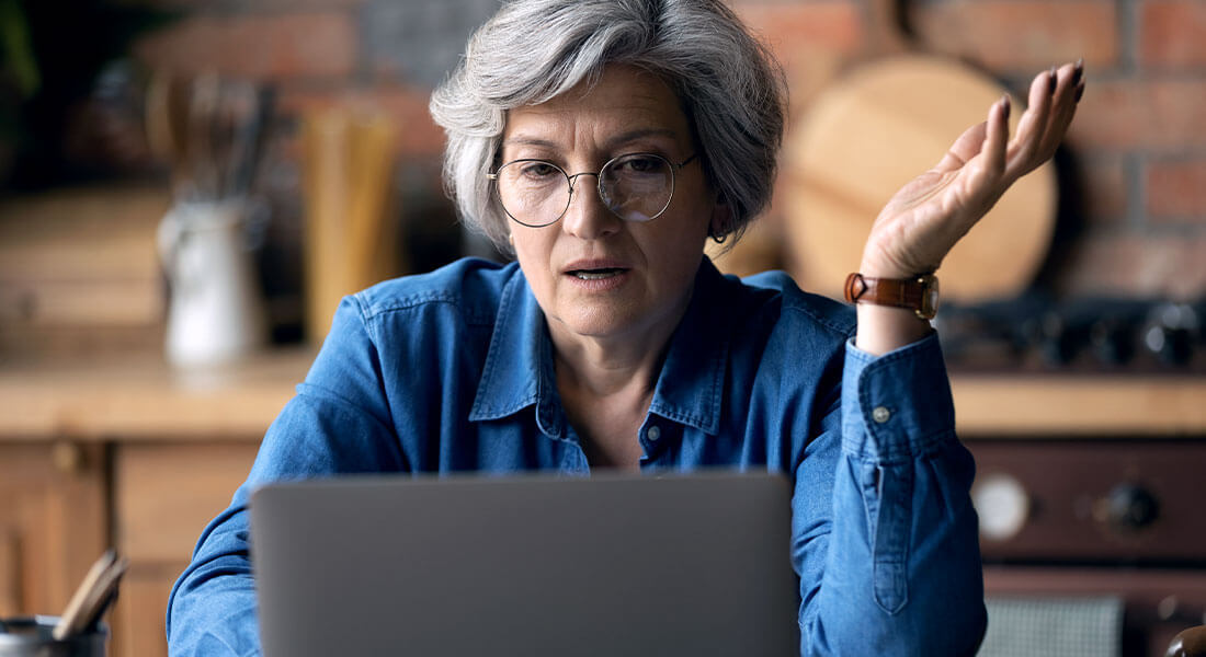 Elderly woman checking her online accounts