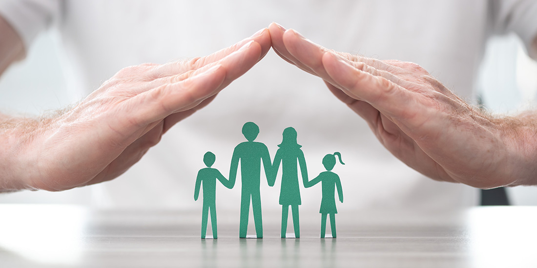Old man's hands protecting the family