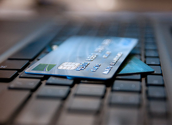 Credit cards stacked on a keyboard