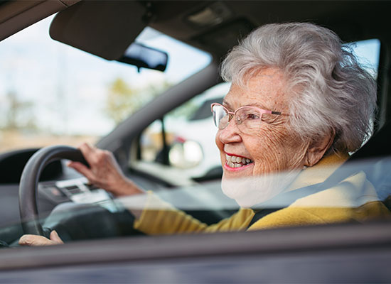 elderly woman driver wearing her seatbelt